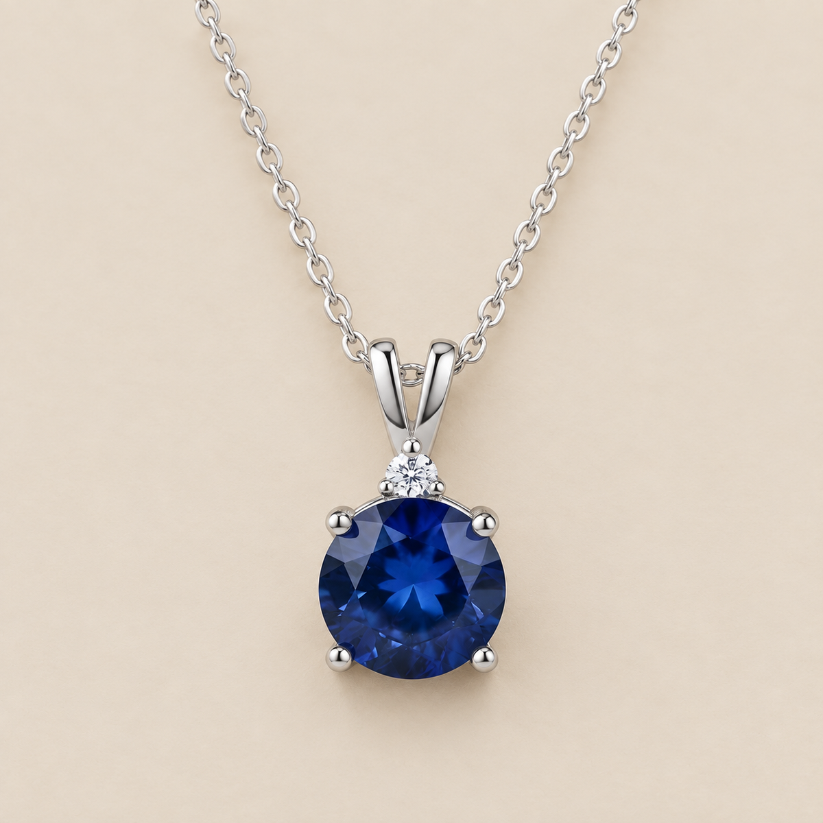 Round Cut Sapphire Necklace — cream studio photograph