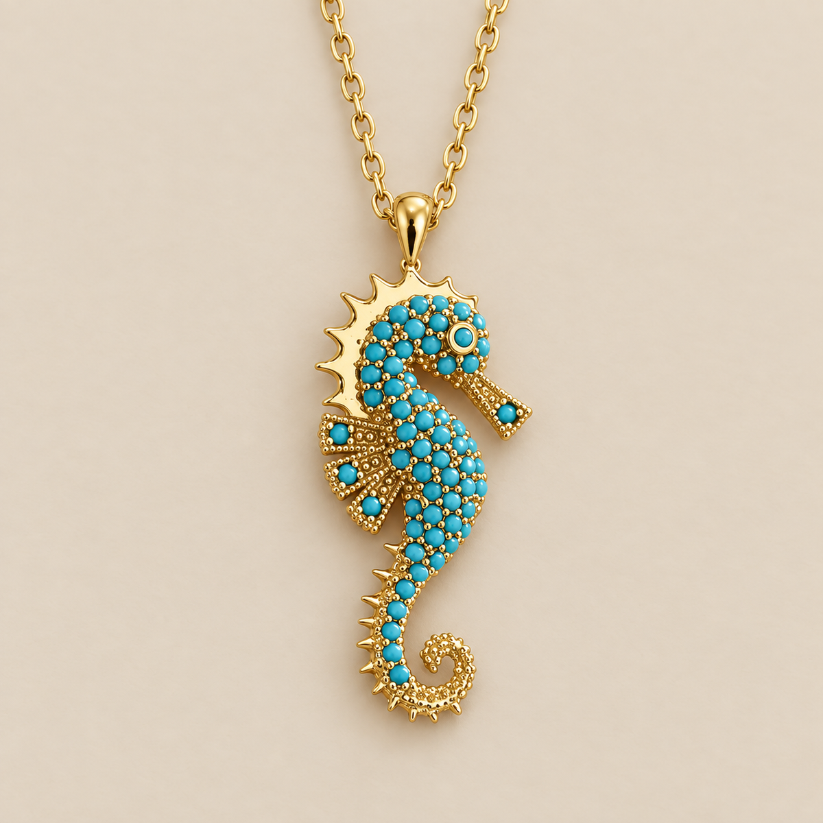 Gold Seahorse Turquoise Pendant Necklace — cream studio photograph