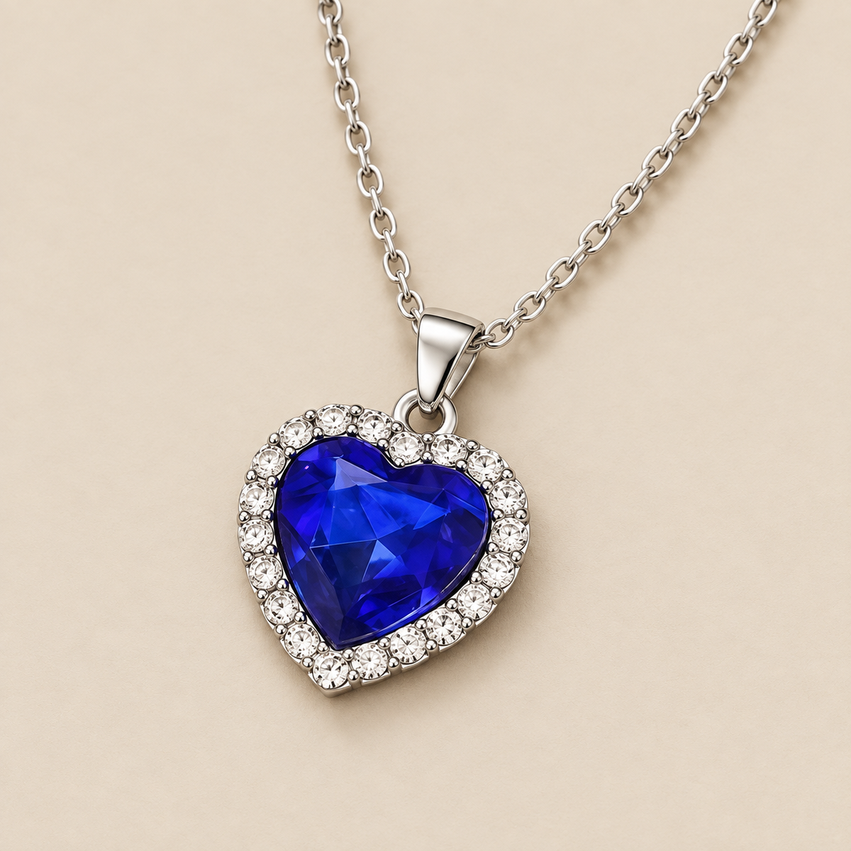 Sapphire Heart Pendant Necklace — cream studio photograph