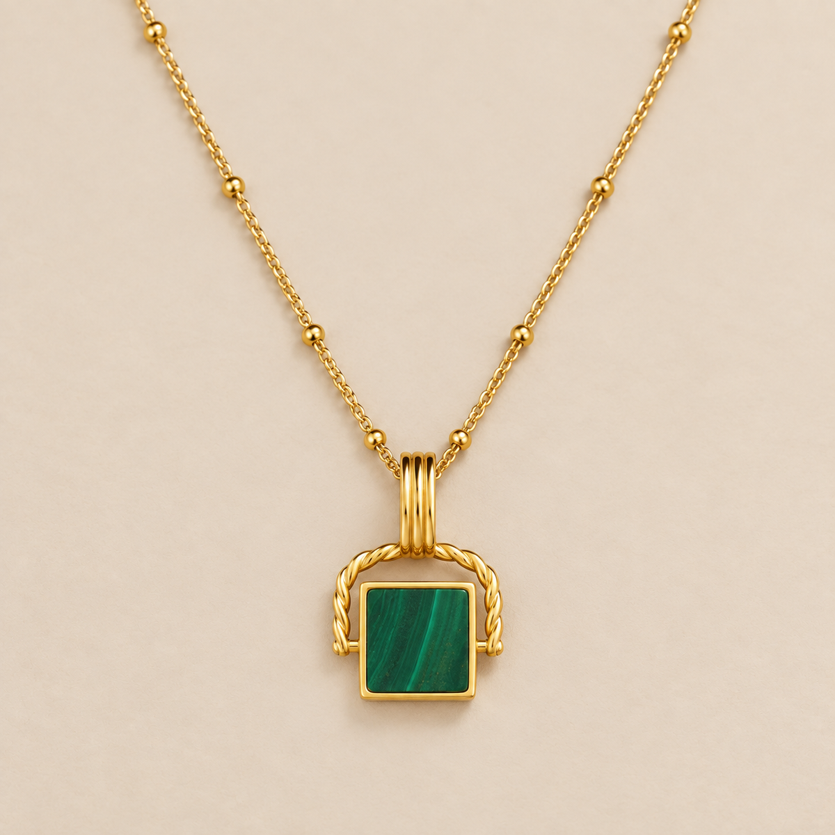 Malachite Pendant with Beaded Gold Chain — cream studio photograph