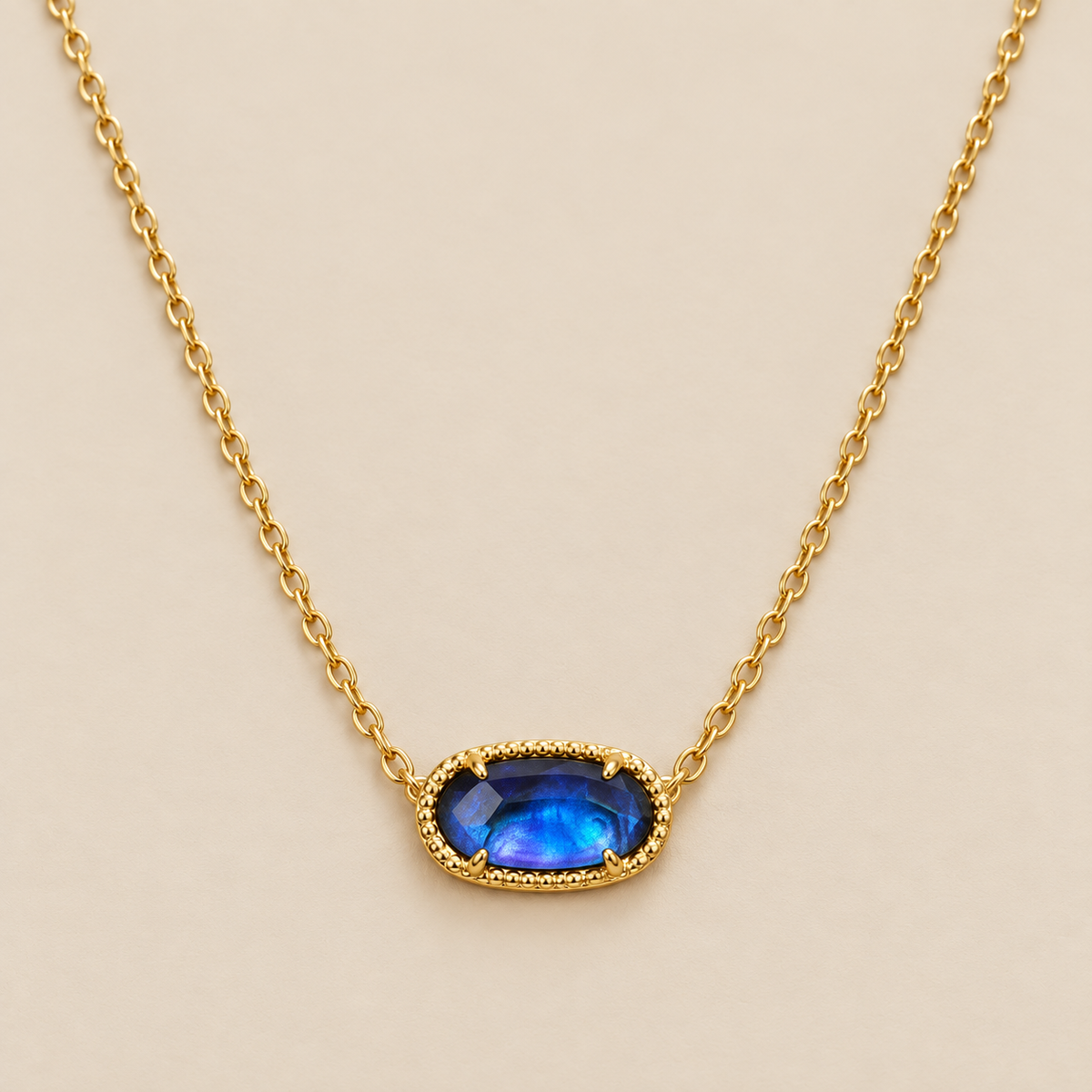 Classic Oval Sapphire Necklace — cream studio photograph