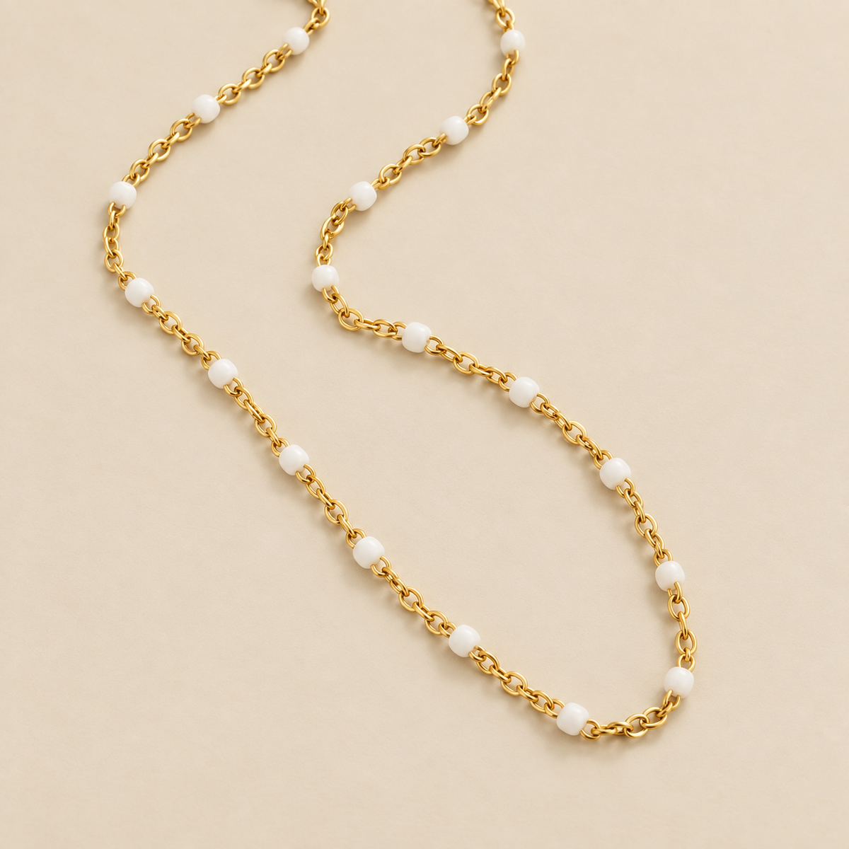 Clean White Bead Necklace — cream studio photograph