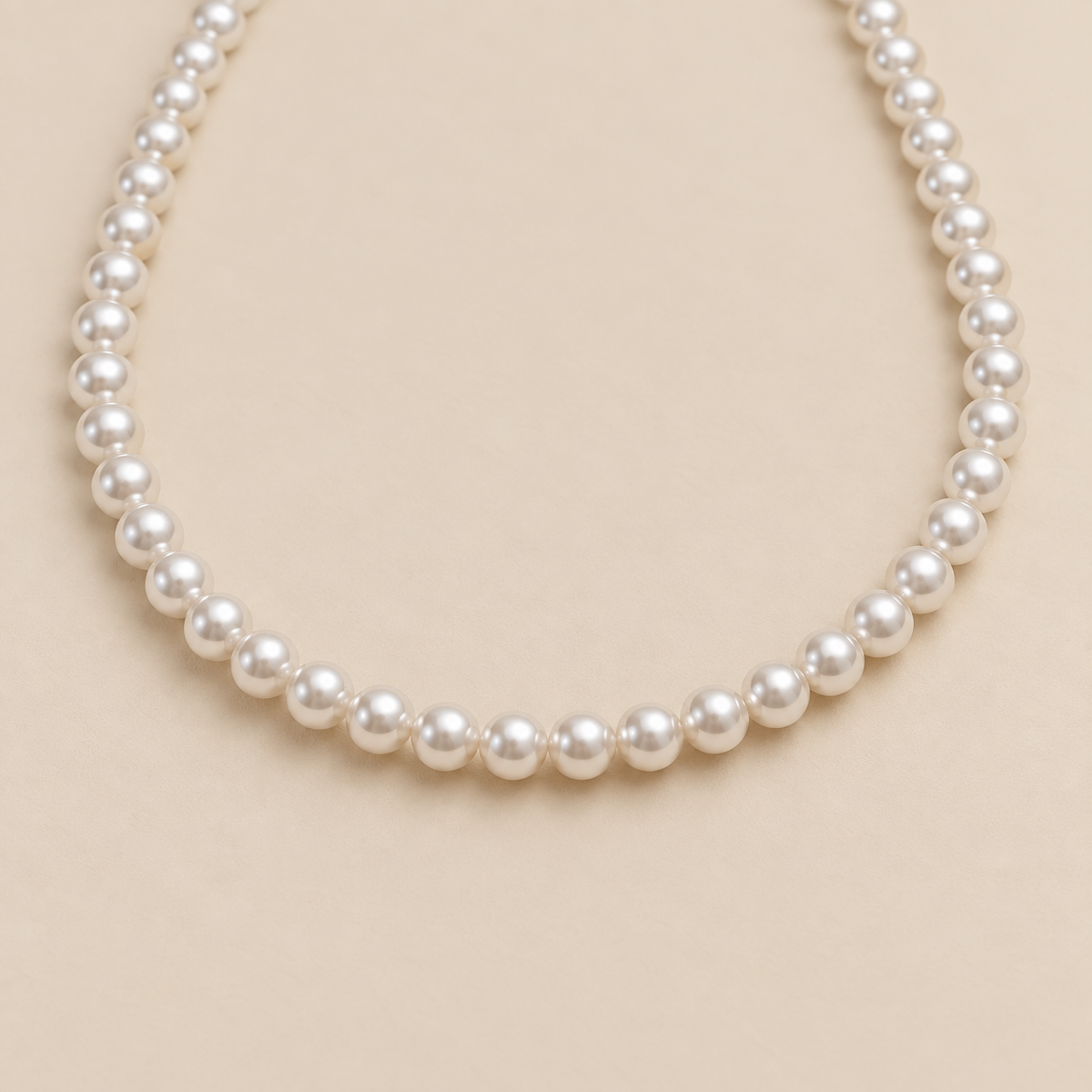 Classic White Pearl Necklace — cream studio photograph