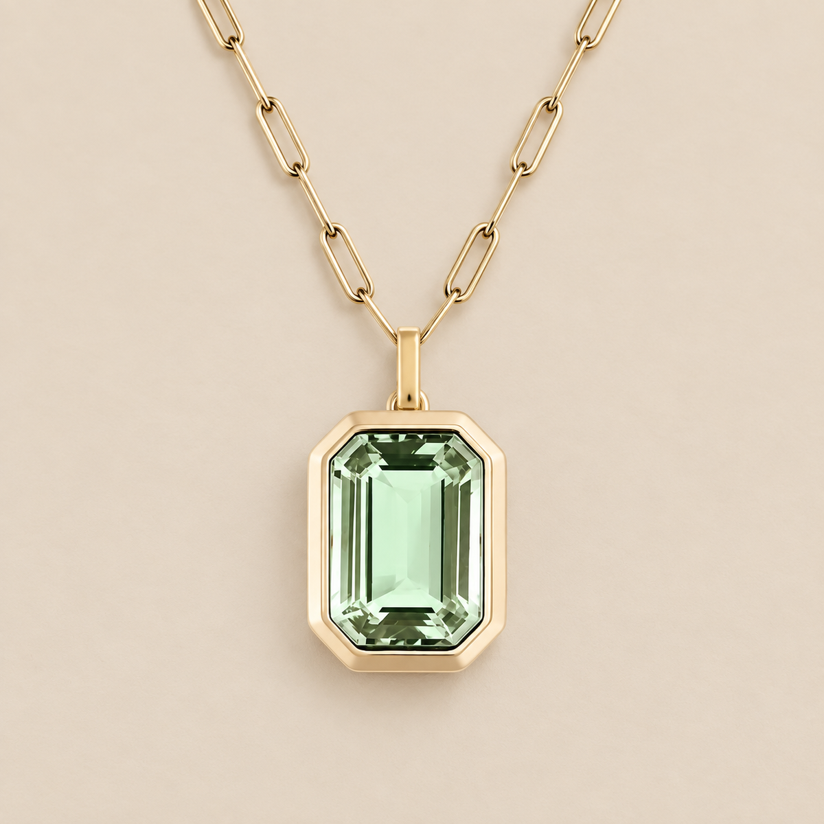 Elegant Emerald Paperclip Link Necklace — cream studio photograph