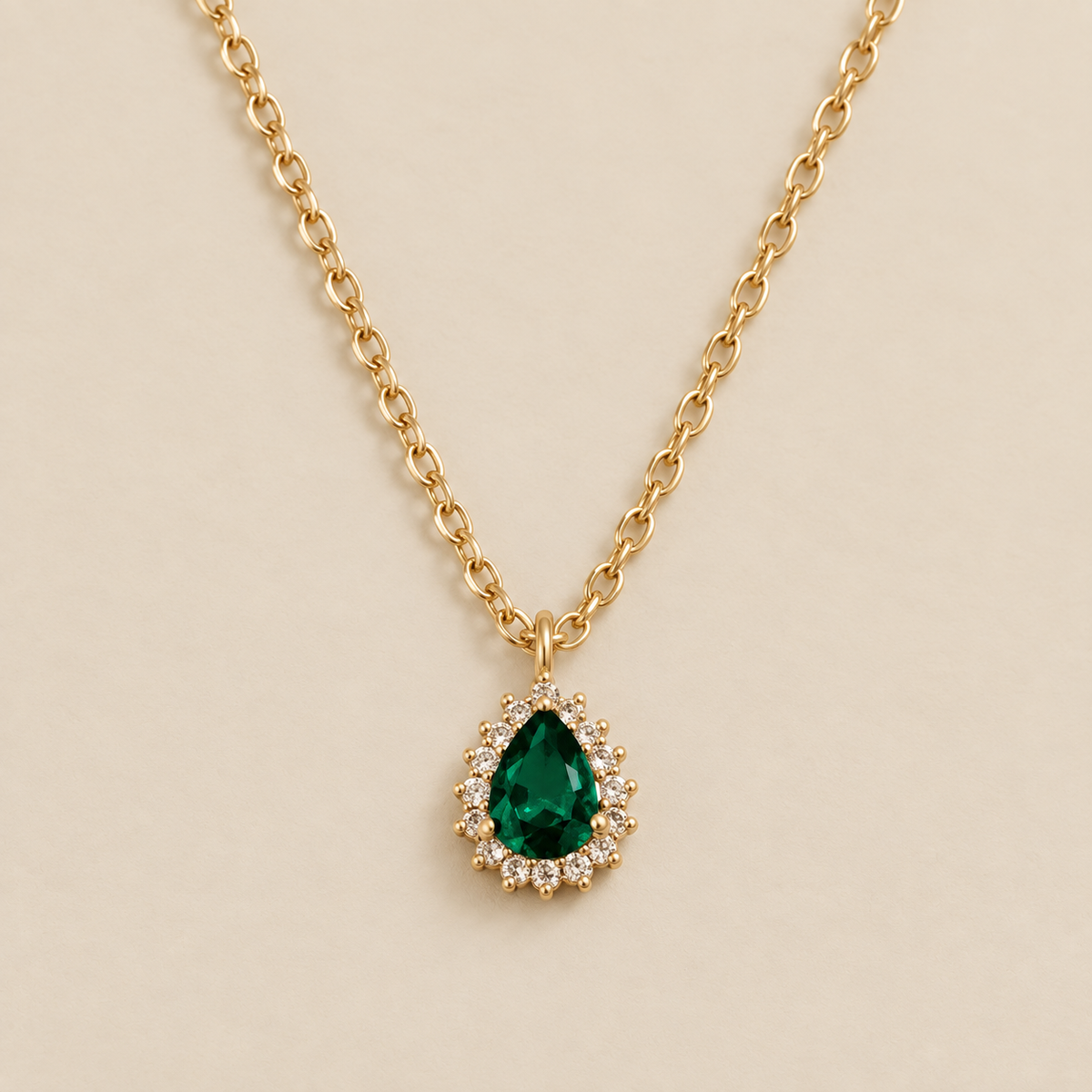 Elegant Emerald Stone Dew Necklace — cream studio photograph