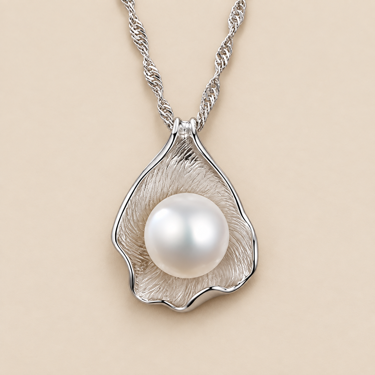 Seashell Pearl Pendant Necklace — cream studio photograph