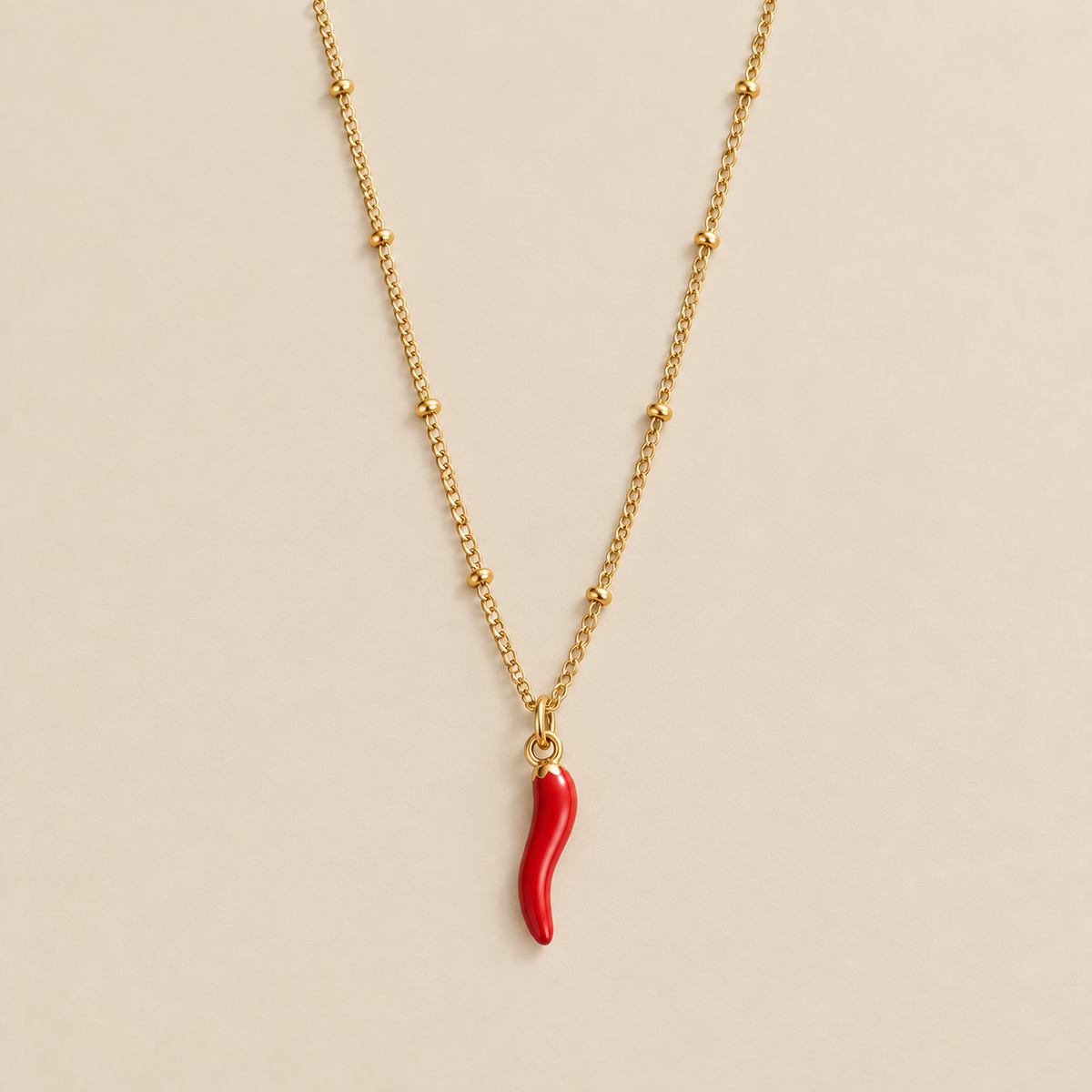 Radiant Red Chilli Pendant Necklace — cream studio photograph