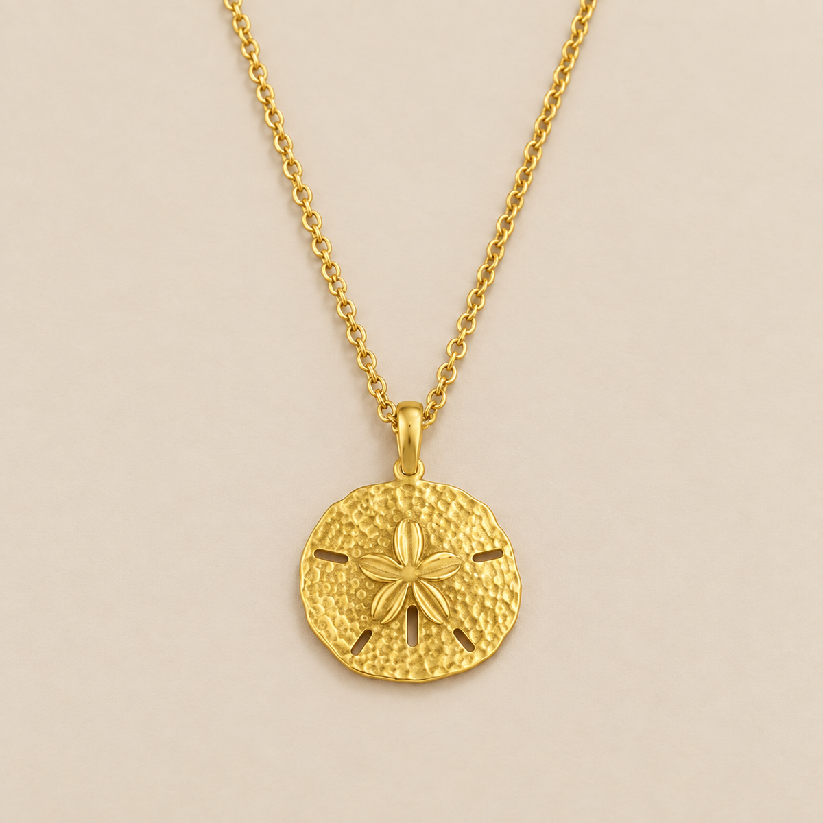 Sand Dollar Charm Necklace — cream studio photograph