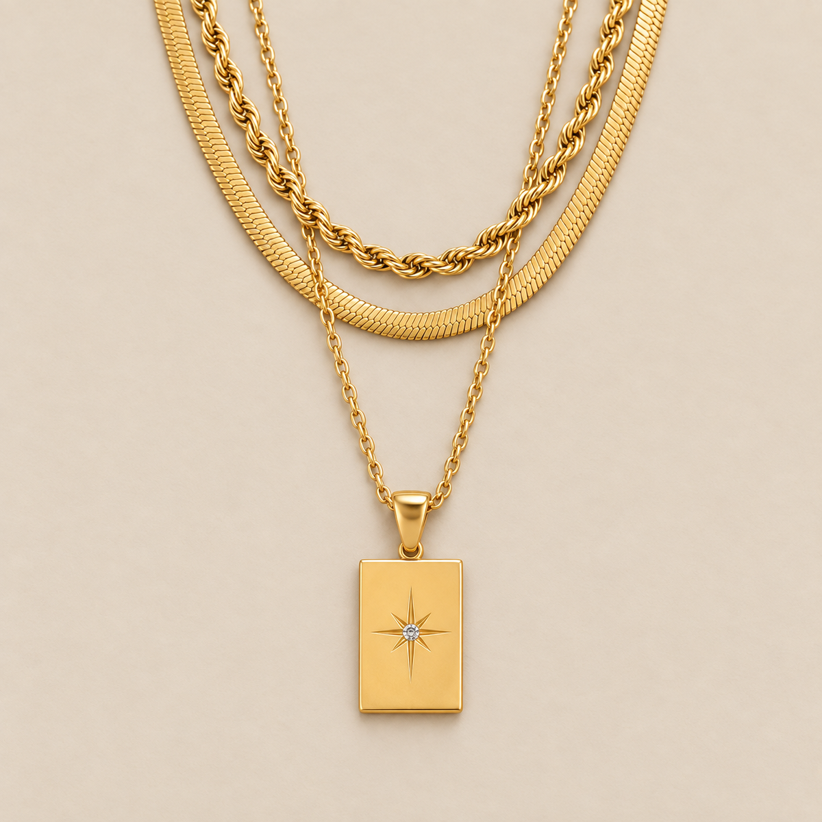 Elegant Triple Gold Chain Necklace — cream studio photograph