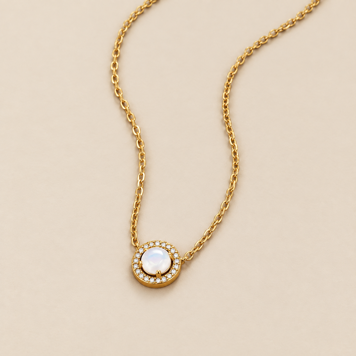 Gold Monet Crystal Necklace — cream studio photograph
