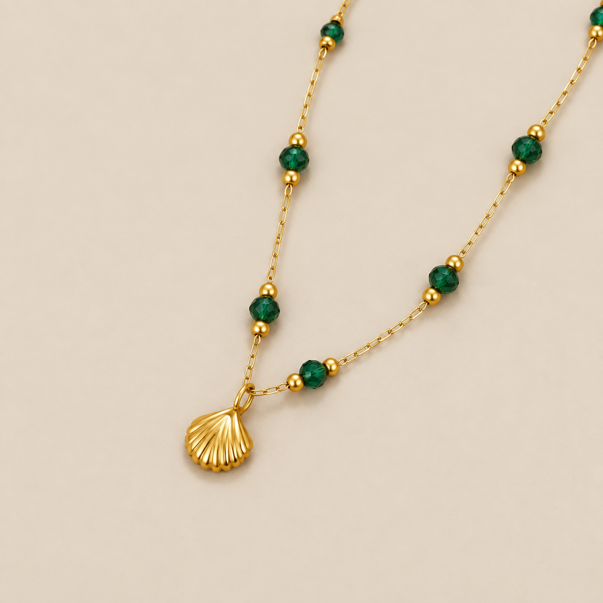 Nerissa Gold Shell & Green Bead Necklace — cream studio photograph