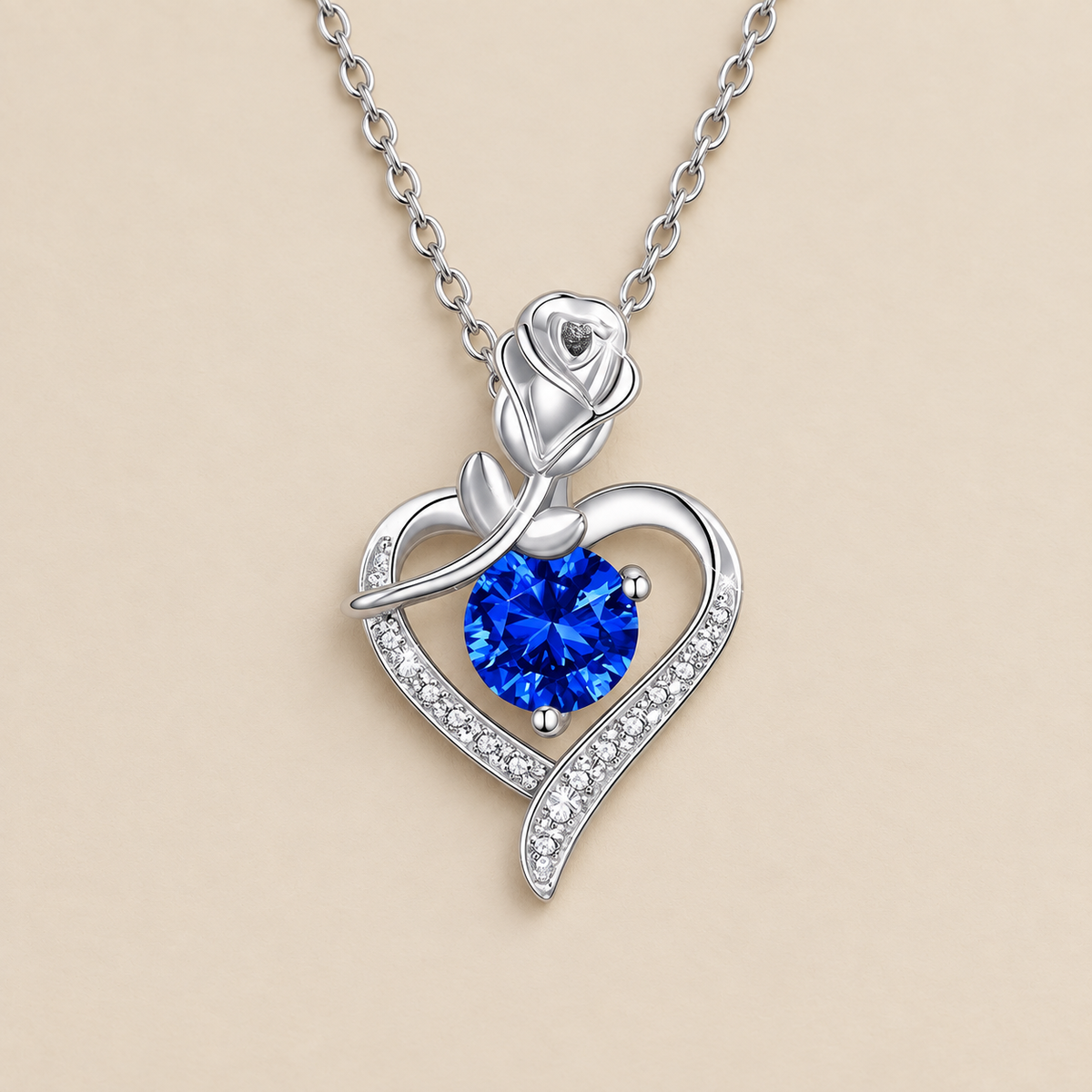 Sapphire Rose Heart Necklace — cream studio photograph