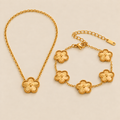 Golden Clover Necklace & Bracelet Set — studio photograph