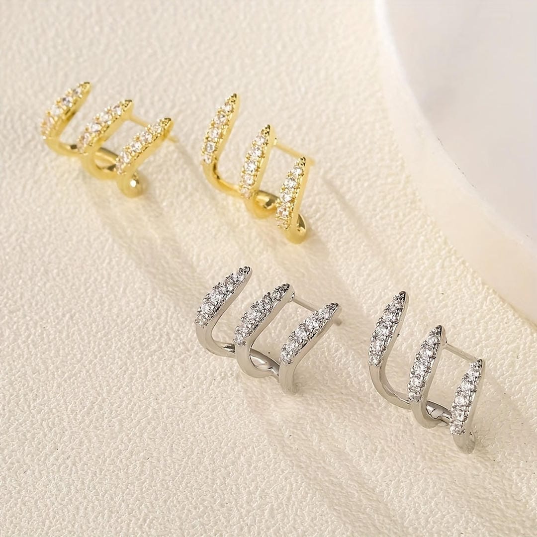 Elegantes aretes de rinocerontes de tres garras