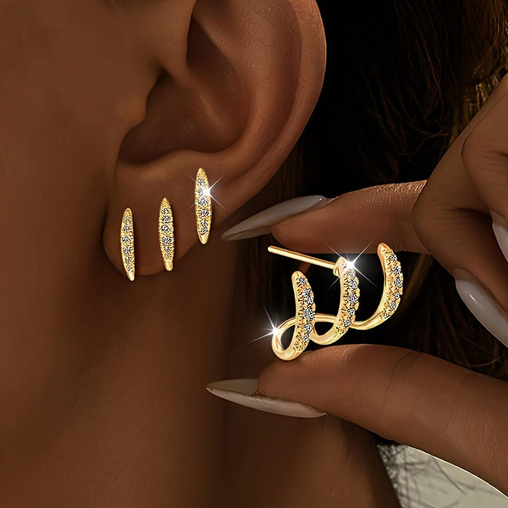 Elegantes aretes de rinocerontes de tres garras