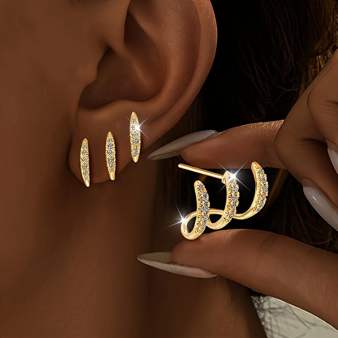 Elegantes aretes de rinocerontes de tres garras