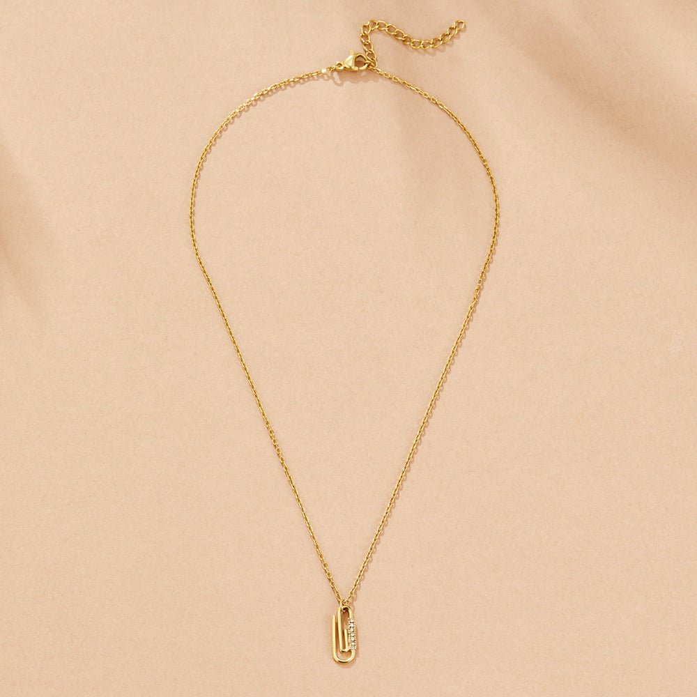 Collar con colgante de clip de cristal dorado