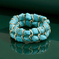Pulsera de oro tejida con piedra turquesa