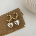 Pendientes elegantes de corazón de perlas