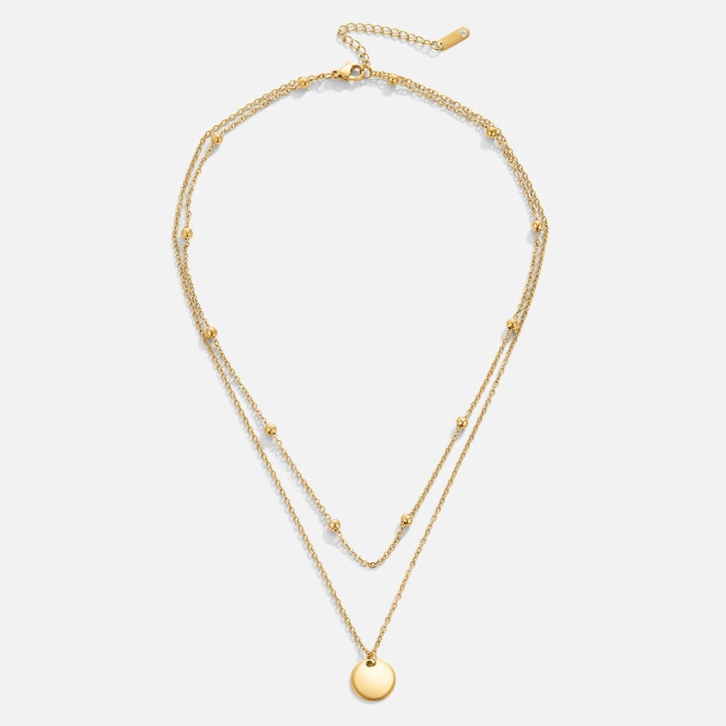 Collar con colgante de disco de oro en capas