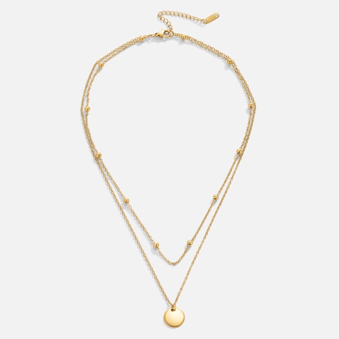 Collar con colgante de disco de oro en capas