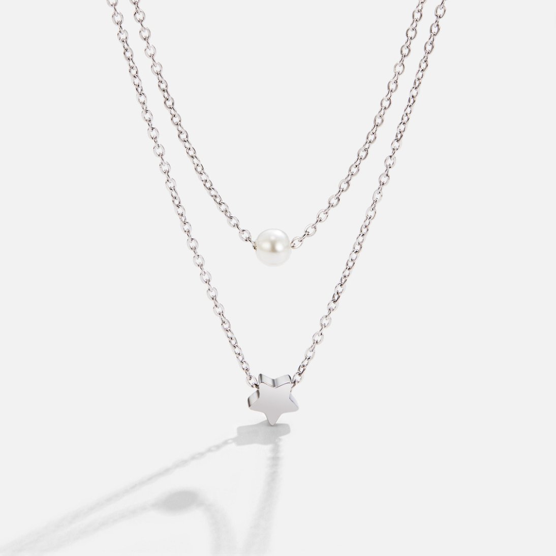 Collar de Perlas y Estrella de Plata de Capas