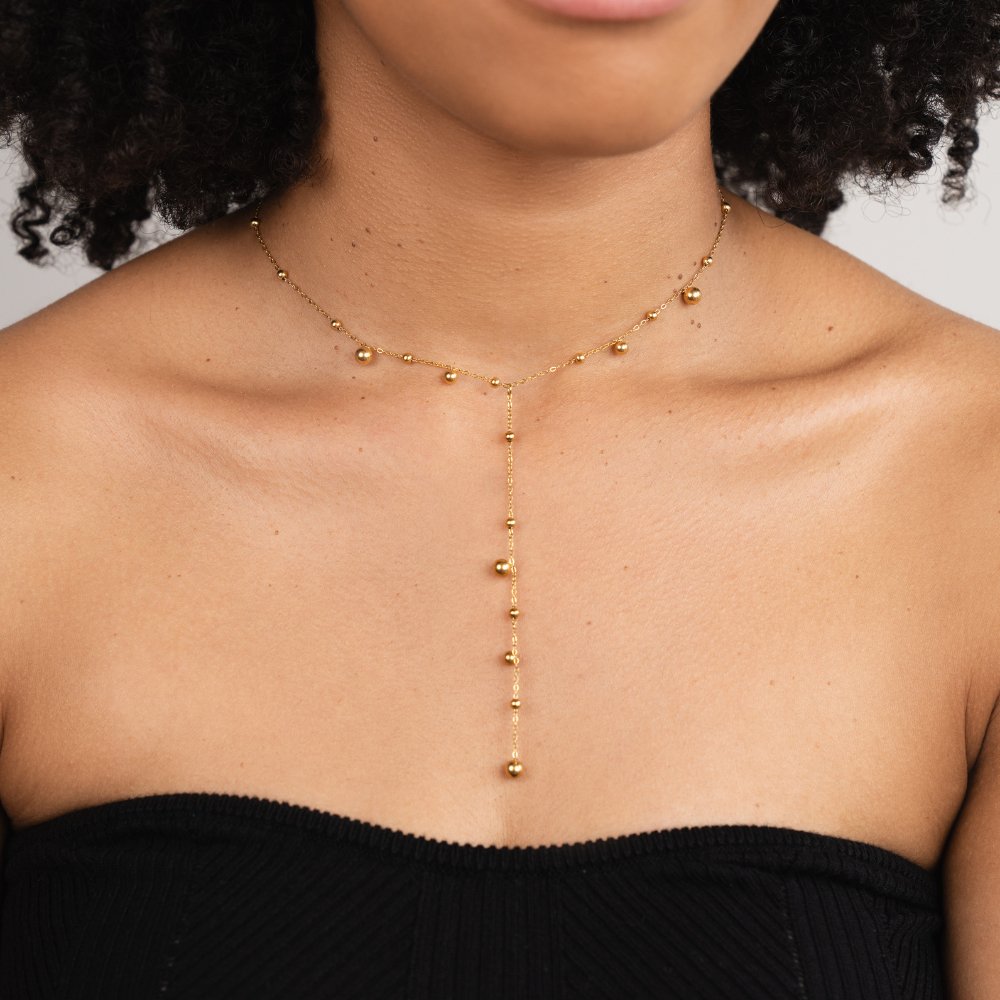 Collar con borla y cuentas doradas Lovi