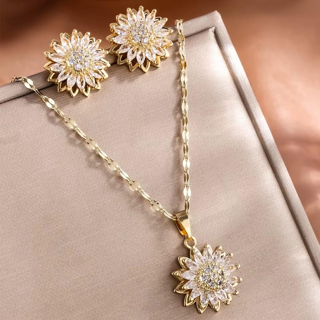 Elegante conjunto de collar y pendientes de circonita de girasol plateado
