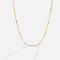 Collar Niyah de cadena dorada con cuentas