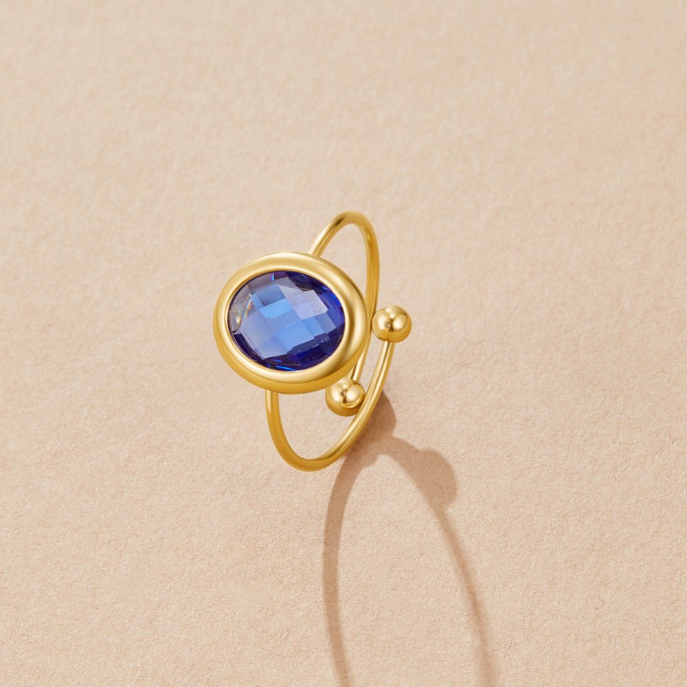 Anillo de oro con cristal azul zafiro