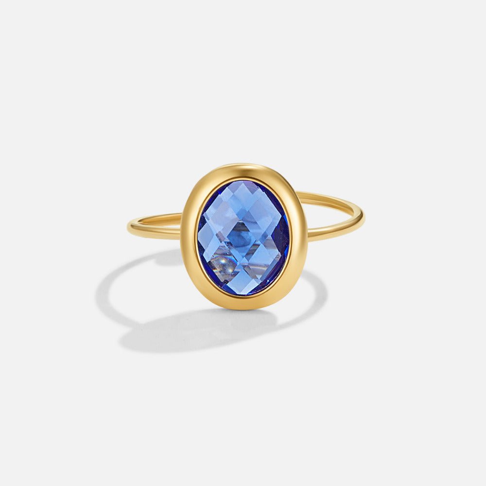 Anillo de oro con cristal azul zafiro
