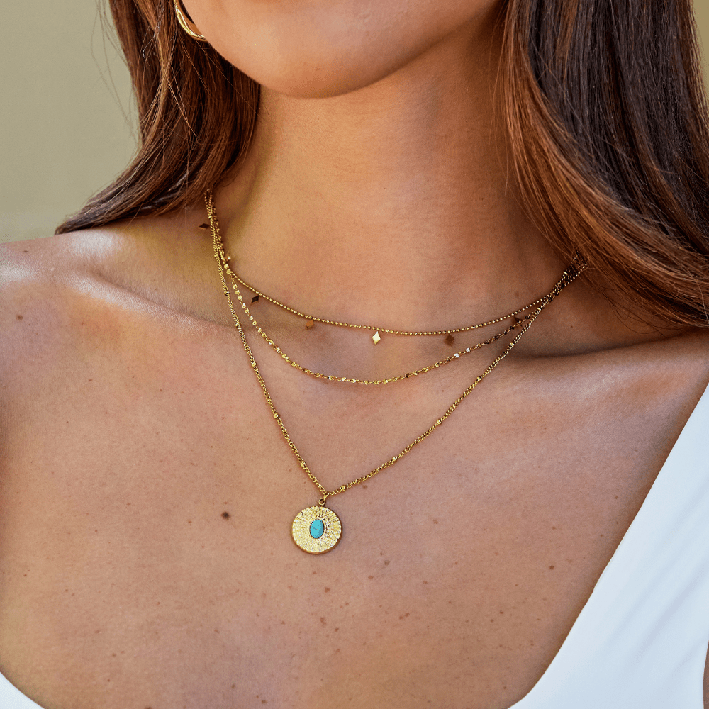 Collar de moneda con piedra turquesa
